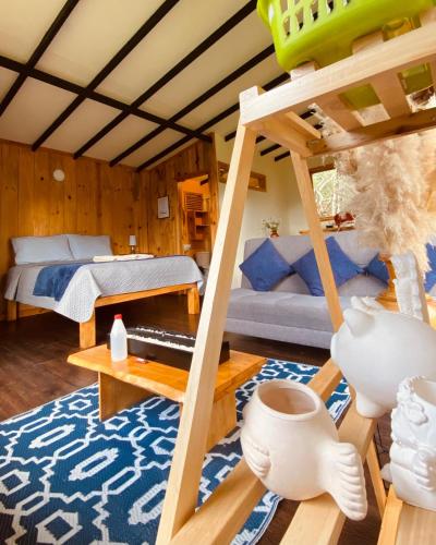 a living room with a bunk bed and a couch at Villa De Los Sueños in Pasto