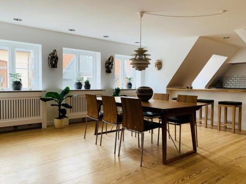 a kitchen and dining room with a table and chairs at Luxury apartment in the heart of Copenhagen in Copenhagen