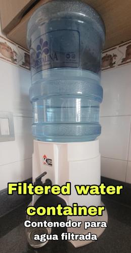 a large container of water sitting on top of a cooler at Panama City Full apartment 20th floor with a view of the sea and mountains in Panama City