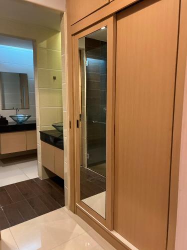 a sliding glass door in a kitchen with a sink at Royal Kamala - 1 separated bedroom Condo in Kamala Beach