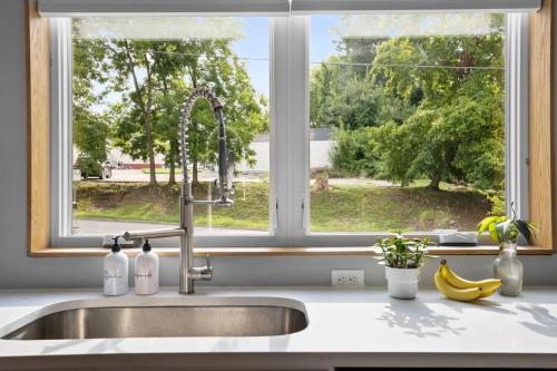 a kitchen sink with a window in a kitchen at On Cloud Durham Unit B in Durham