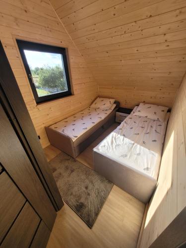 an overhead view of a small room with two beds at Jodłowy domek na Roztoczu in Obrocz