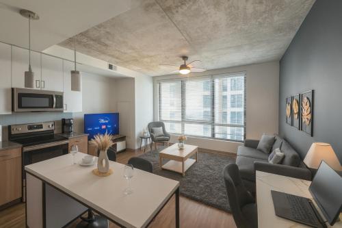 a living room with a couch and a table at City Escape 2BR Apt with Resort Amenities in Birmingham