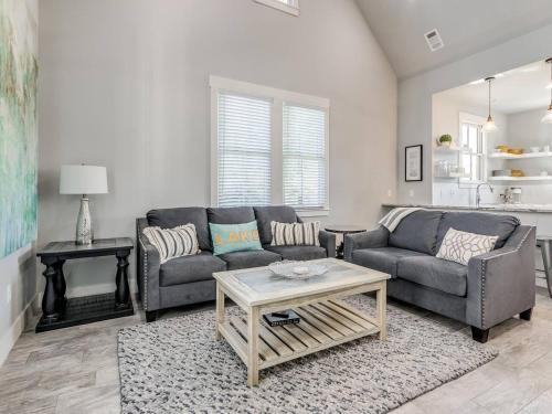 a living room with two couches and a coffee table at Shore Enough, Carlton Landing Lakeview in Carlton Landing