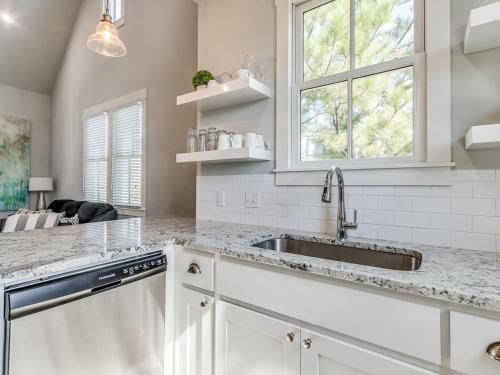 a kitchen with a sink and a window at Shore Enough, Carlton Landing Lakeview in Carlton Landing