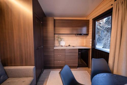 a small kitchen with a sink and a window at Basecamp in Yllas for Adventures in Ylläsjärvi