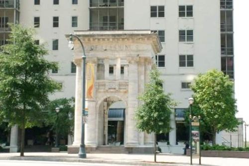a stone building with an arch in front of a building at 20N - Stylish 1BD 1BA Condominium in the Heart of Downtown in Atlanta