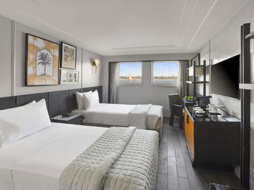 Postel nebo postele na pokoji v ubytování Mövenpick MS Sunray