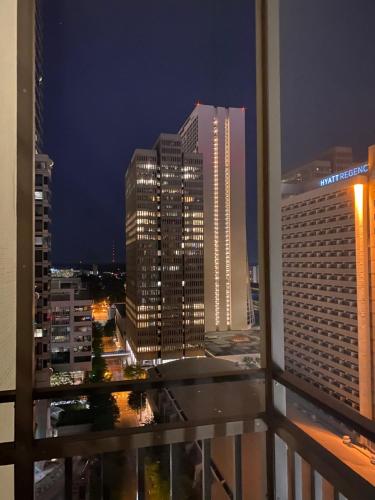 a view of a city at night from a balcony at 8th Floor Stylish Downtown Condo Private Balcony in Atlanta