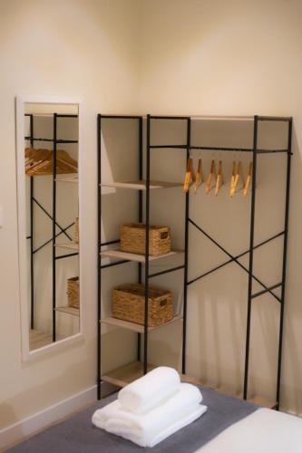 a closet with a mirror next to a bed at Luminoso Bilbao in Bilbao