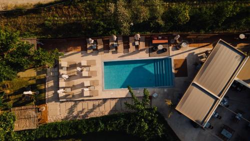 an overhead view of a swimming pool in a resort at Eterrano Seaside Retreat in Parga