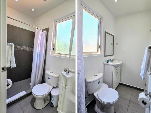 a white bathroom with two toilets and a sink at Bubali Residence in Palm-Eagle Beach