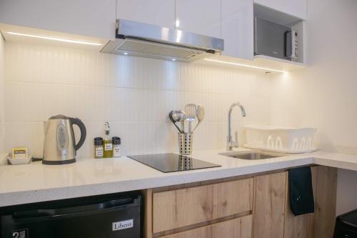 a kitchen with a sink and a counter top at Seaside Studio 1BR near the Malecon in Miraflores in Lima