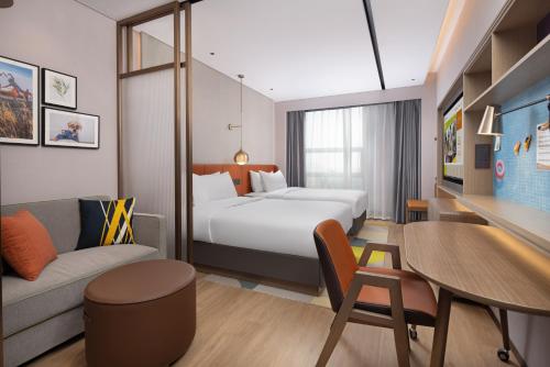 Katil atau katil-katil dalam bilik di Home2 Suites by Jinan Shanghe