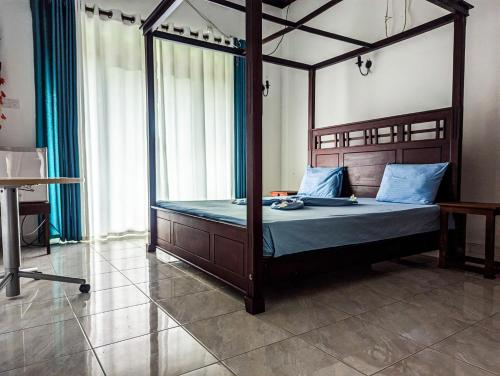 Кровать или кровати в номере Wella Kotuwa Villa Aluthgama