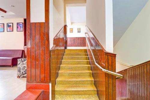 a hallway with a staircase in a building at Super Collection O Pioneer in Mussoorie