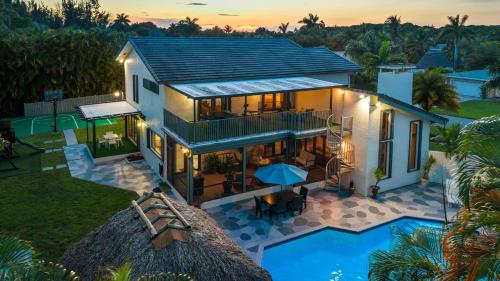an aerial view of a house with a pool at Cherry RoyaleGrand Villa in Davie