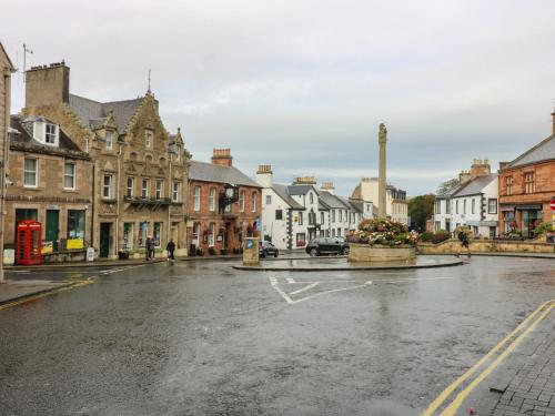 an empty street in a town with buildings at 2 East Port in Melrose