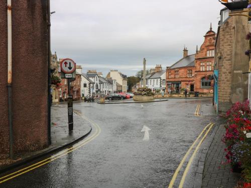 an empty street in a town in the rain at 2 East Port in Melrose