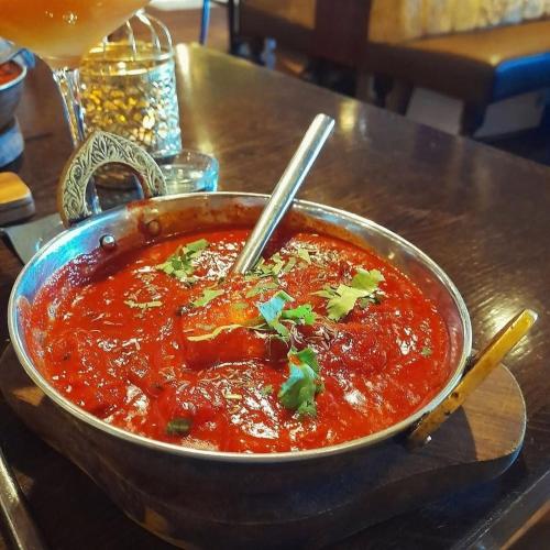 a bowl of soup sitting on a table at 4 Sisters Inn in North Kyme