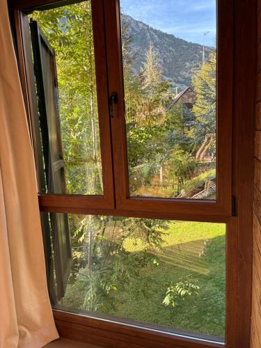 a window with a view of a mountain at Eth Estel de Salardú--Casa con vistas de ensueño-Fibra Optica- 5 TV in Salardú
