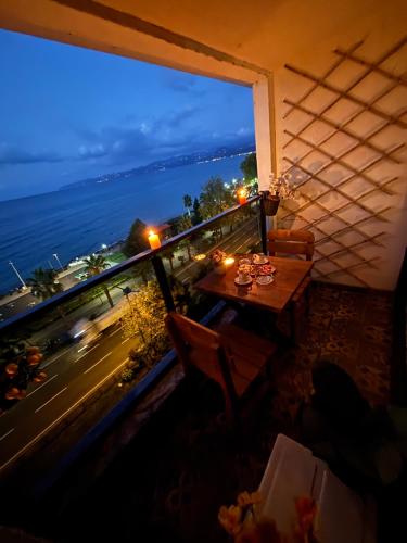 a balcony with a table and a view of the ocean at N Suite2 in Ordu