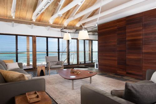 a living room with a view of the ocean at Spectacular spacious 8 bedroom family villa in Providenciales