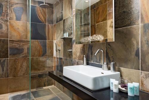 a bathroom with a sink and a mirror at Spectacular spacious 8 bedroom family villa in Providenciales
