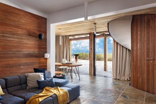 a living room with a couch and a table at Spectacular spacious 8 bedroom family villa in Providenciales