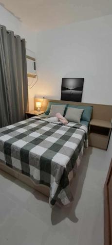 Una cama o camas en una habitación de Royal Ocean Crest- Mactan