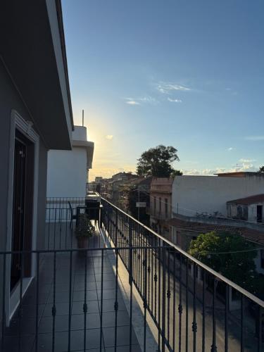 a balcony with a view of a city at Nacional B&B in Monforte San Giorgio Marina