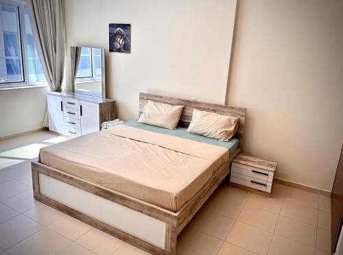 a bedroom with a bed in a room at Apartment in Al Barsha1 Near by Metro in Dubai