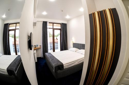 Кровать или кровати в номере Hotel Urban Bliss