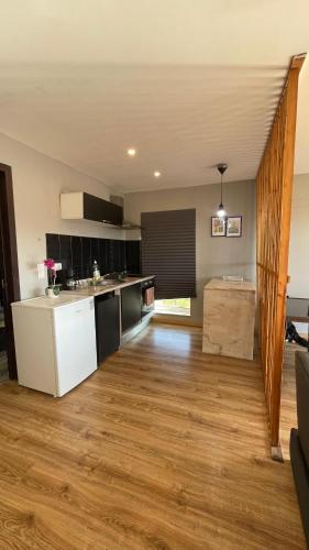 a large kitchen with a counter top and a counter top at Porto Vista Douro Apart in Valbom