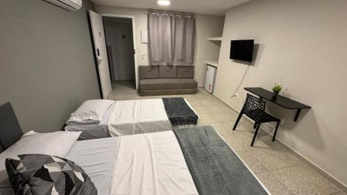 Postel nebo postele na pokoji v ubytování Êxito Loft