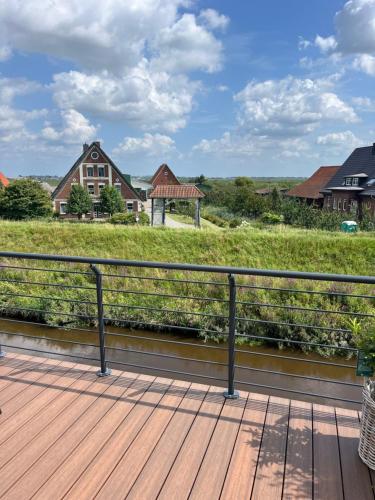 a view from the deck of a house at Ferienhaus "Deichperle" mit Flussblick in Steinkirchen