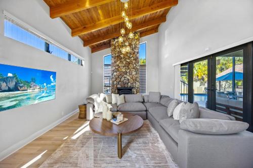 a living room with a couch and a table at Cherry RoyaleGrand Villa in Davie
