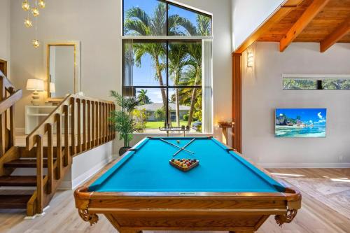 a pool table in a room with a staircase at Cherry RoyaleGrand Villa in Davie
