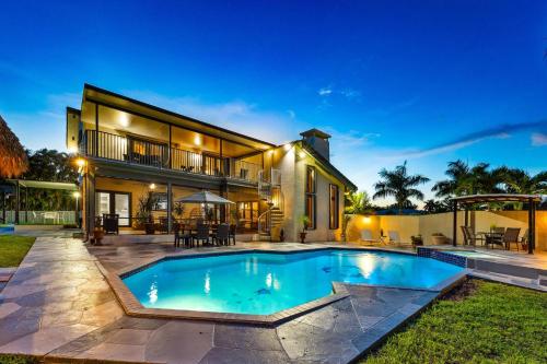 an image of a house with a swimming pool at Cherry RoyaleGrand Villa in Davie
