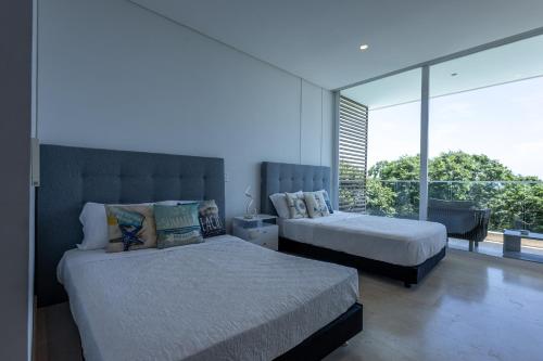 Ένα ή περισσότερα κρεβάτια σε δωμάτιο στο Brand new 4BR Villa at Calablanca