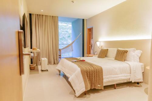 Postel nebo postele na pokoji v ubytování Eagle Boutique Hotel