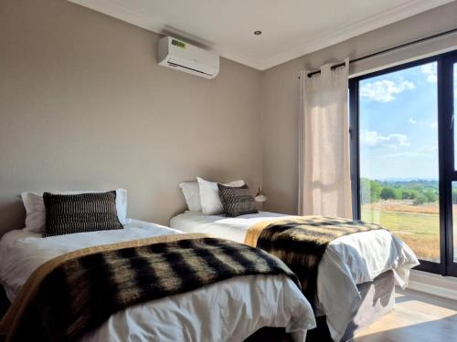 Ένα ή περισσότερα κρεβάτια σε δωμάτιο στο Golf Course Haven