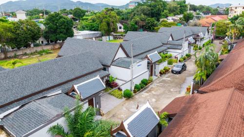 an aerial view of a row of houses with roofs at summer stay pool villa in Ban Na Bon