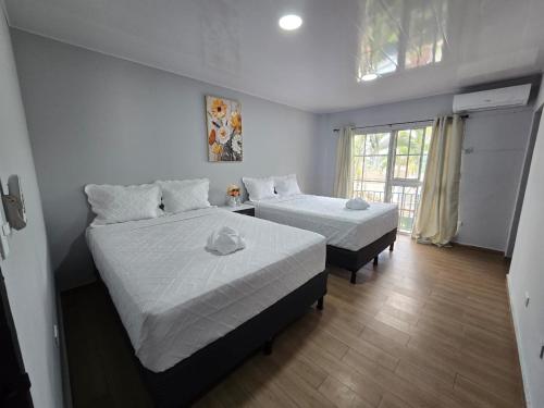 Ένα ή περισσότερα κρεβάτια σε δωμάτιο στο Mi Tierra Escalón Hotel y Restaurante