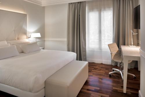 Cama o camas de una habitación en NH Collection Gran Hotel de Zaragoza