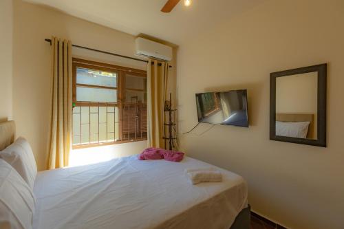 Postel nebo postele na pokoji v ubytování Casa 3 quartos com Wi-Fi, Ar e Churrasqueira