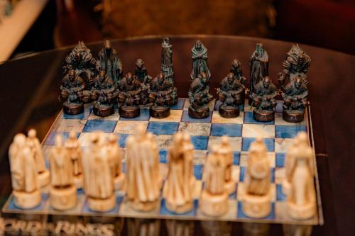 a chess set on a chess board at Montgomery Inn BnB in Versailles