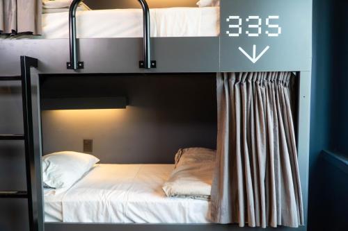 a couple of bunk beds in a room at MONS hostel in Buenos Aires