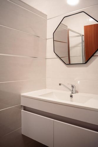 a bathroom with a sink and a mirror at Home Away Haven in Brakpan