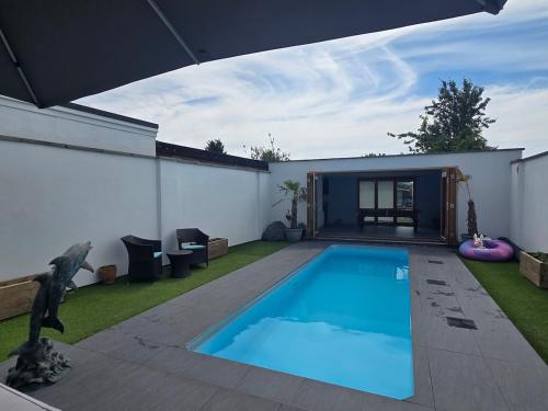 a swimming pool in the backyard of a house at Villa at 58 London Rd in Amesbury